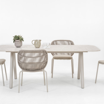 Vincent Sheppard Kodo dining set featuring a dune white dining table with a textured shards surface and matching Kodo dining chairs in dune white with cushions.