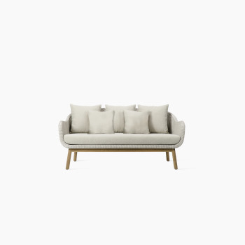 Anton lounge sofa in old lace colour by Vincent Sheppard, featuring a woven Paper Loom frame with a natural wood base and five beige cushions.