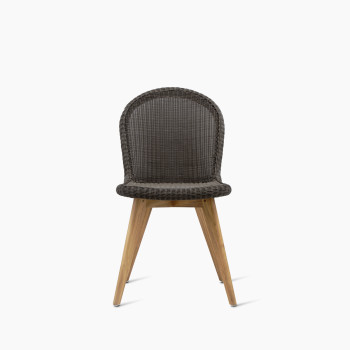 Damien dining chair with a teak base in mocca colour, featuring a synthetic wicker seat and a curved backrest.