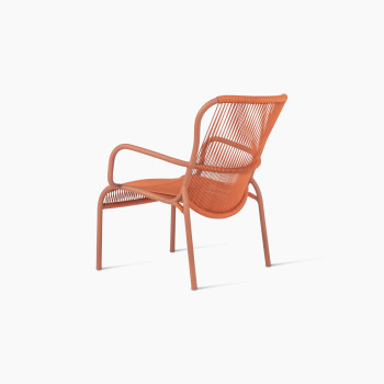 Rear-angle view of Vincent Sheppard Loop lounge chair with aluminium frame and rope in terracotta	