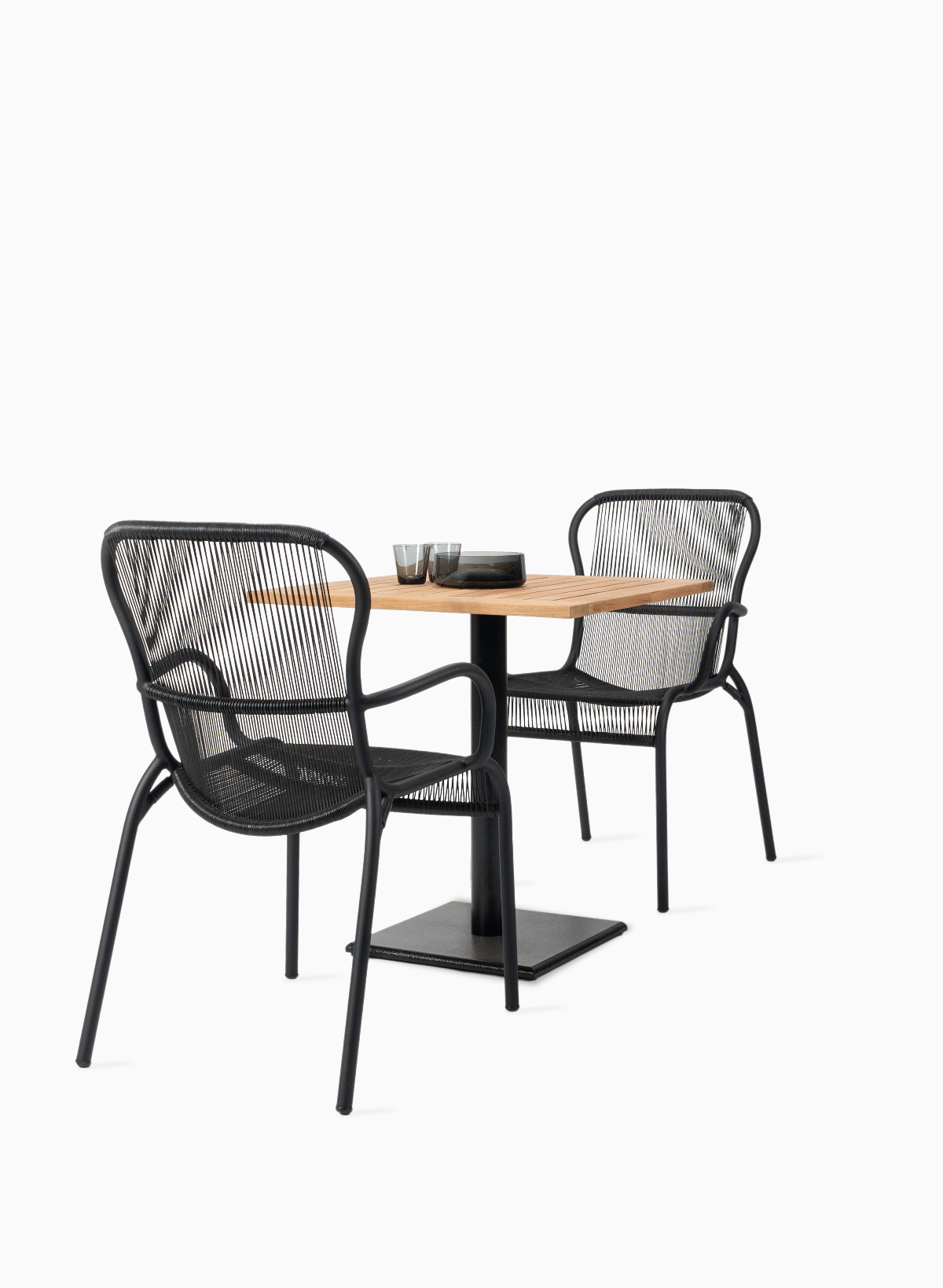 Vincent Sheppard Loop dining chairs with Quadro bistro table on white background