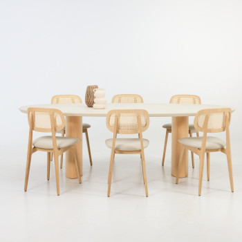Vincent Sheppard Foster dining table with elliptical Mineral plaster top and Natural oak, surrounded by Titus dining chairs in lime white bouclé and Natural oak	