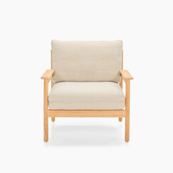 Vincent Sheppard Oda lounge chair with Lime White bouclé cushions and raw teak frame	