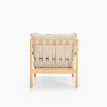 Back view of Vincent Sheppard Oda lounge chair with Lime White bouclé cushions and raw teak frame	